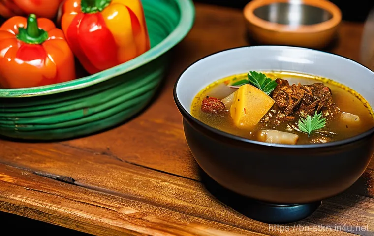 세인트키츠 네비스 전통음식 - **A comforting bowl of 'Goat Water' stew, served in a rustic, inviting local restaurant in St. Kitts...